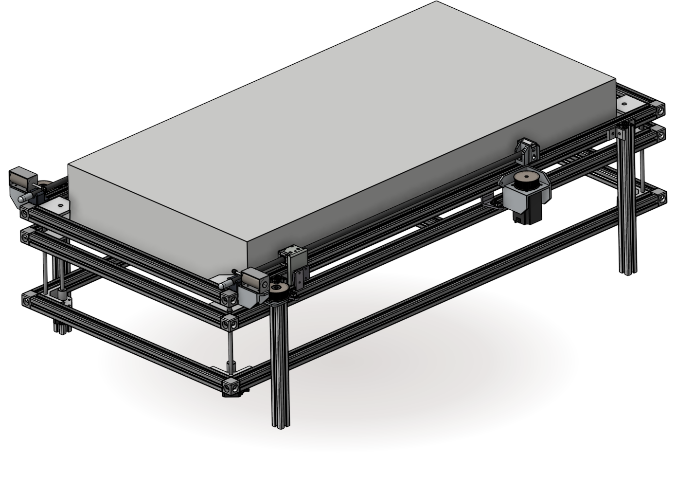 The nook bed-changing rig: a mattress on an aluminium-extrusion frame with belt-driven carriages on each side.